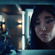 Kahyun Kim as the god of New Media gazing down on the Technical Boy (Bruce Langley) in American Gods’ second season.